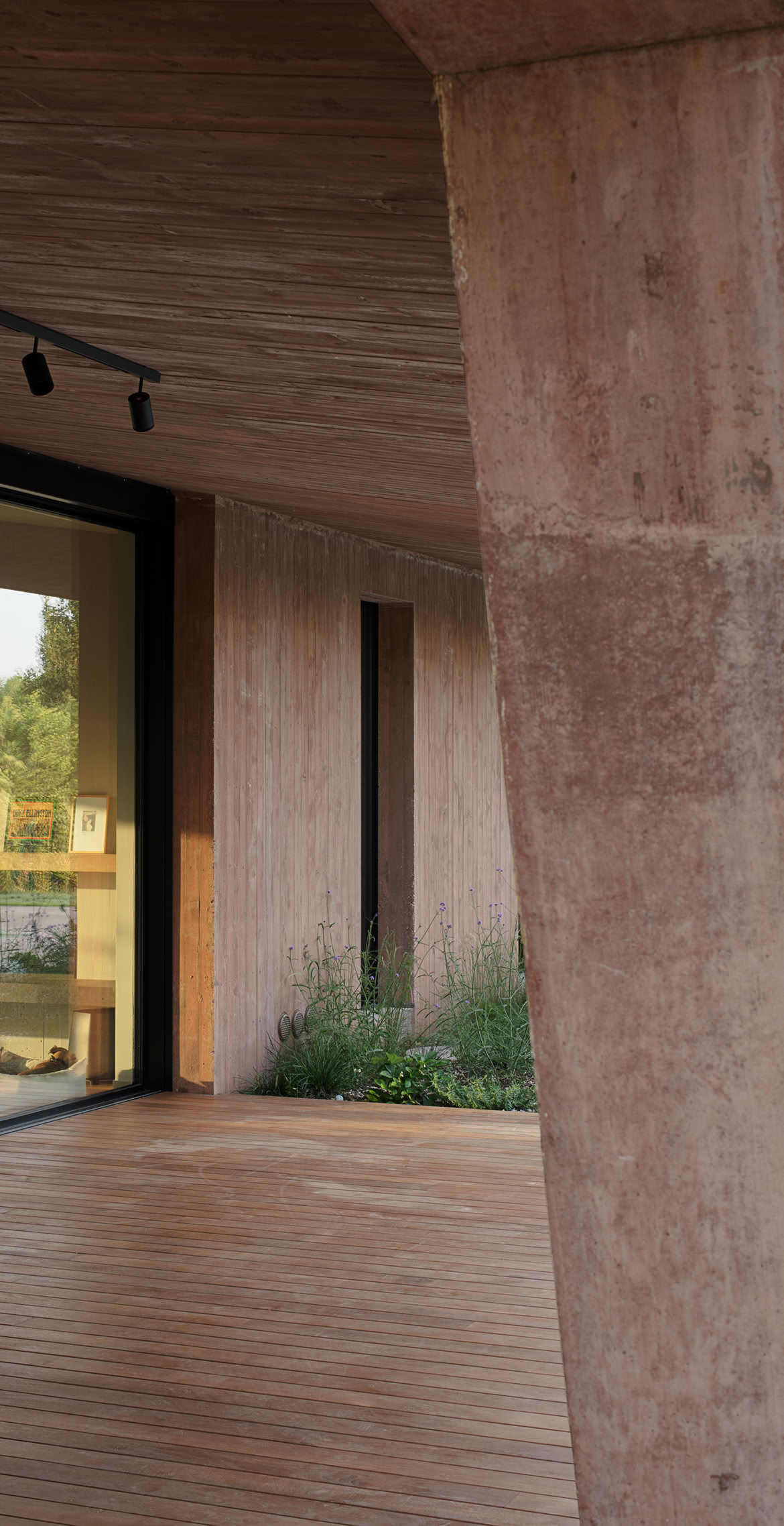 Detail of the villa’s sculptural column, defining a sheltered outdoor portico designed for year-round living.