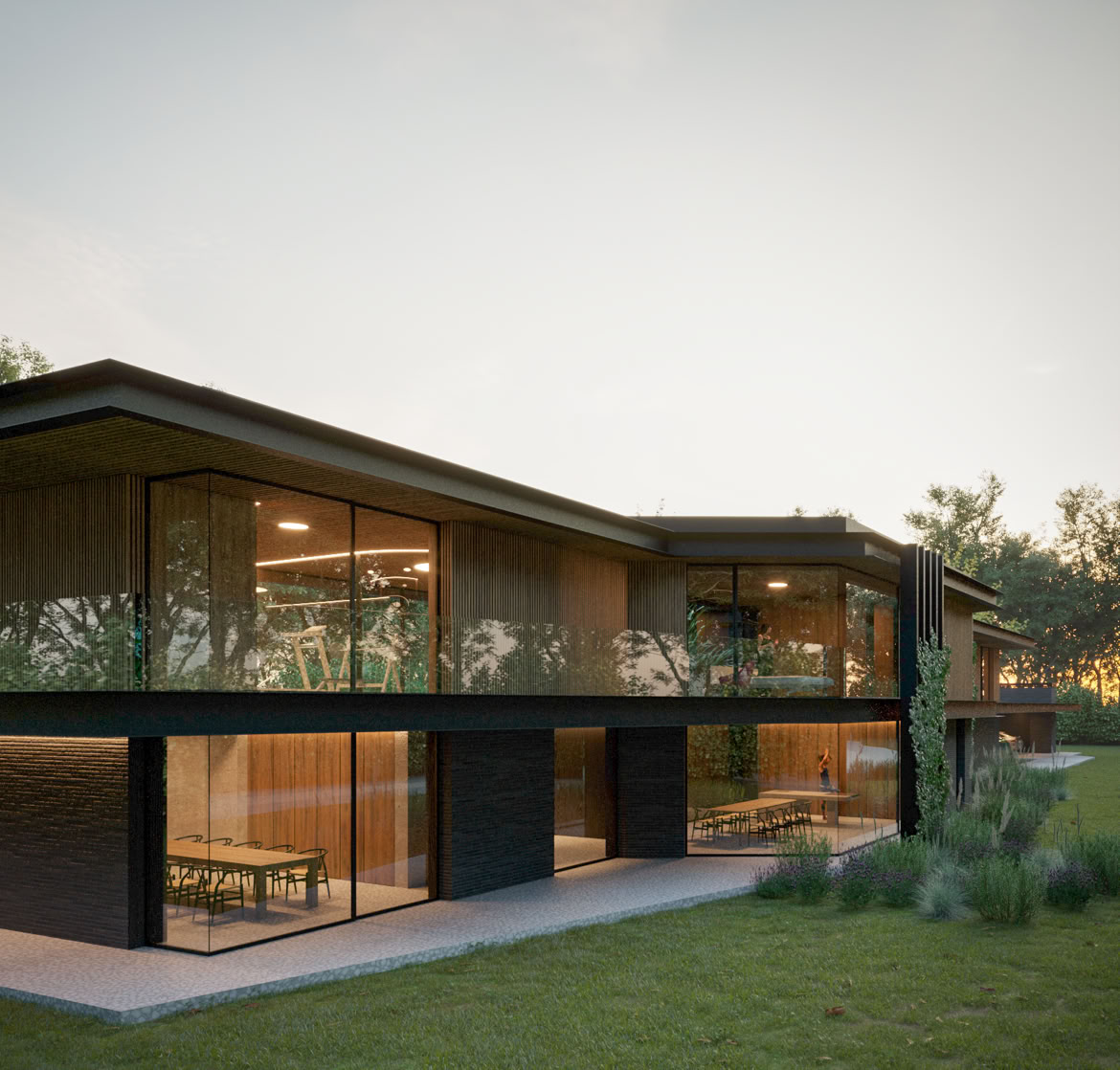 Contrasto tra il basamento in pietra e il piano superiore in legno, soluzione che rafforza il dialogo tra architettura e natura.